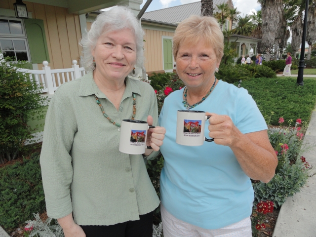 Kathleen Muzzy LaMorte and Phyllis McLaren Sommerman hold the coveted 50th Reunion mugs.