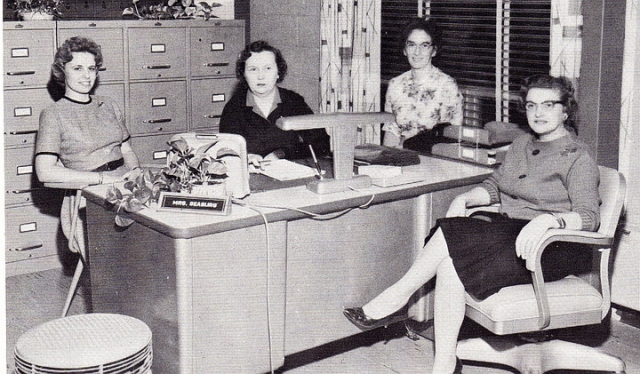 Anne Sherwood working in the high school office after graduation.