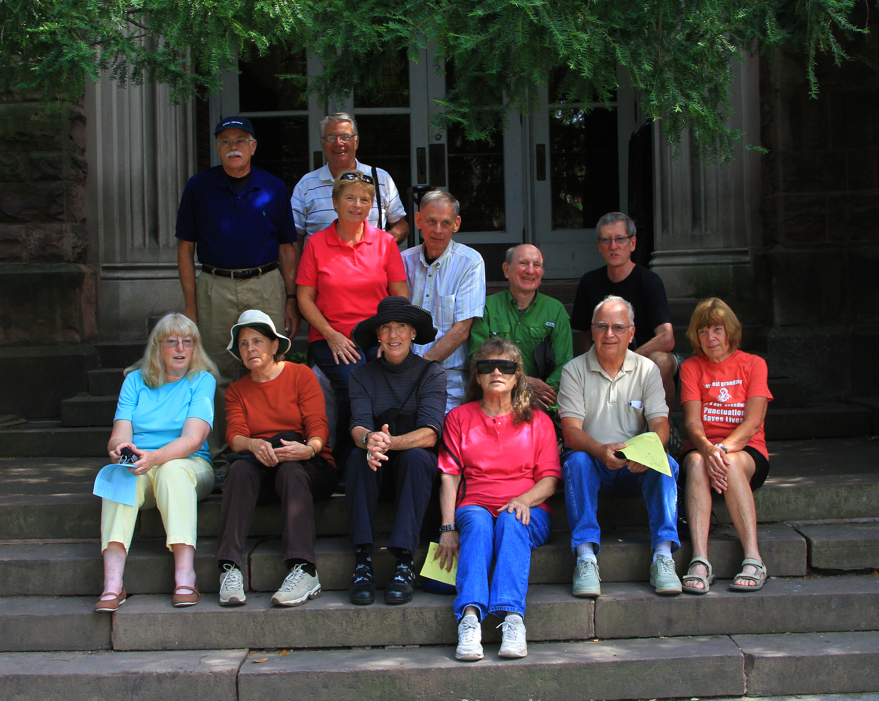 Some of our 70th Birthday Bash attendees sat on the Cayuga Street steps of the high school.